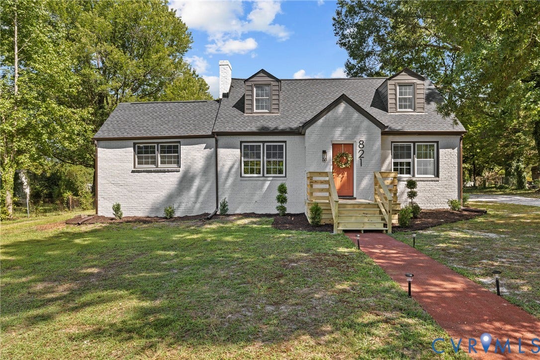 821 Fort Lee Road, North Dinwiddie, VA 23803 White painted brick exterior with dormer windows, new front porch and steps, red brick paver walkway, and mature trees