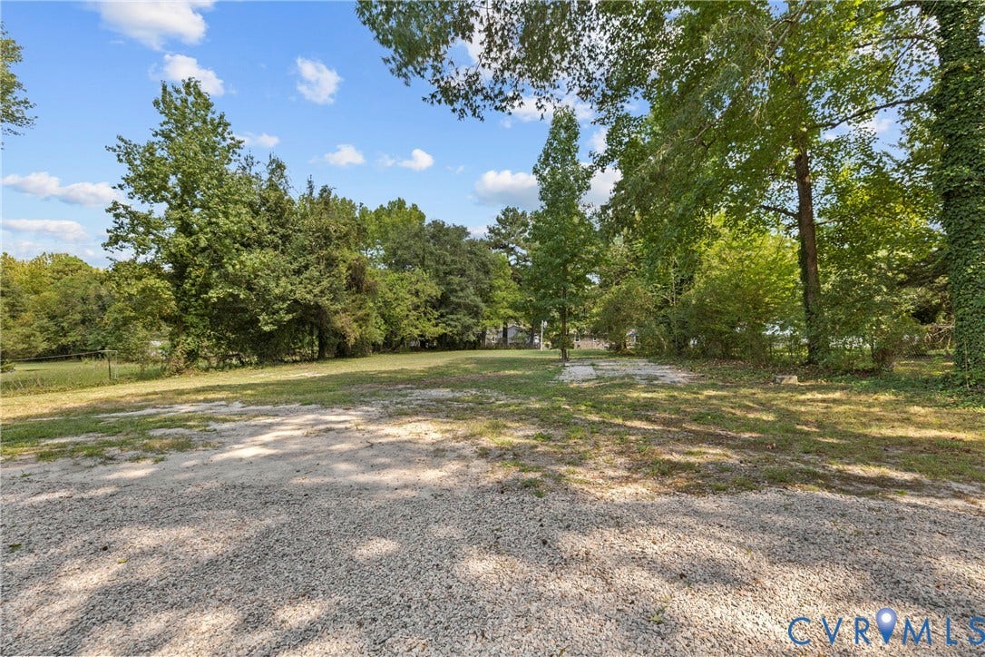 821 Fort Lee Road, North Dinwiddie, VA 23803 Gravel surface area with a surrounding grass lawn