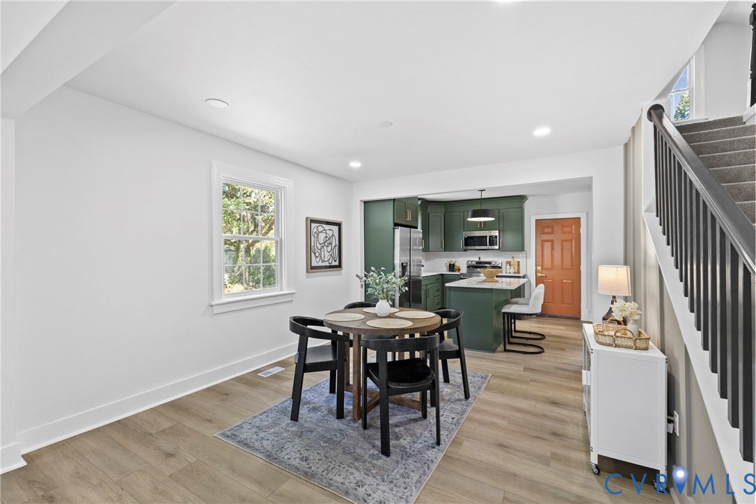 821 Fort Lee Road, North Dinwiddie, VA 23803 Open concept living area featuring wood-finish flooring, recessed lighting, and a kitchen with dark green cabinetry and a white countertop