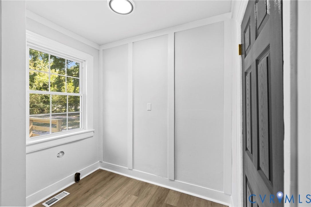821 Fort Lee Road, North Dinwiddie, VA 23803 Recessed ceiling lighting, wood-finish flooring, paneled interior door, and panel wall detailing