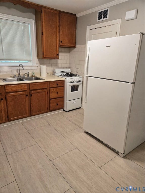 3427 W Franklin Street, Museum District, Richmond, VA 23221 Kitchen featuring wood cabinetry, white subway tile backsplash, a stainless steel sink, and a white gas range