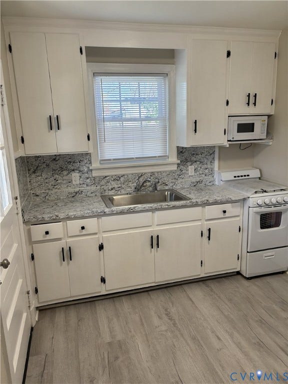 3427 W Franklin Street, Museum District, Richmond, VA 23221 Apt 2 White cabinetry, stainless steel sink, patterned countertops, and wood-finish flooring