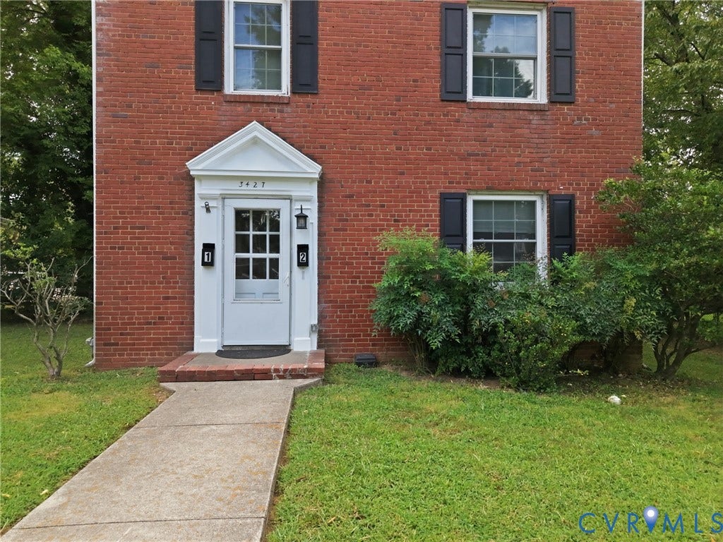 3427 W Franklin Street, Museum District, Richmond, VA 23221 Brick exterior with white trim, featuring a paneled entry door with glass inserts and an overhead pediment