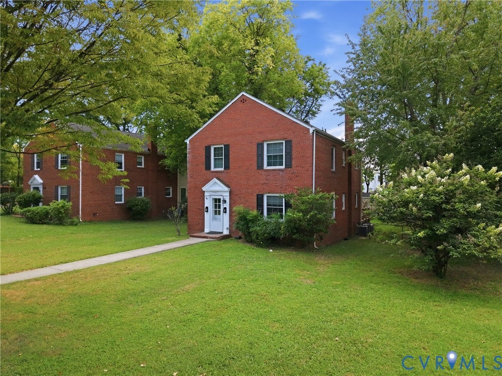 3427 W Franklin Street, Museum District, Richmond, VA 23221 Red brick exterior with white trim, dark window shutters, and a prominent front door