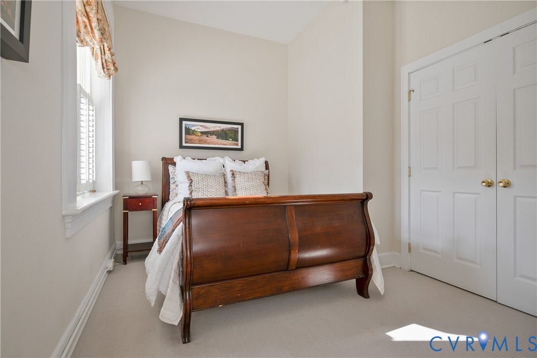 212 W Franklin Street, #U204, Monroe Ward, Richmond, VA 23220 plantation shutters, carpet, and closet with double doors