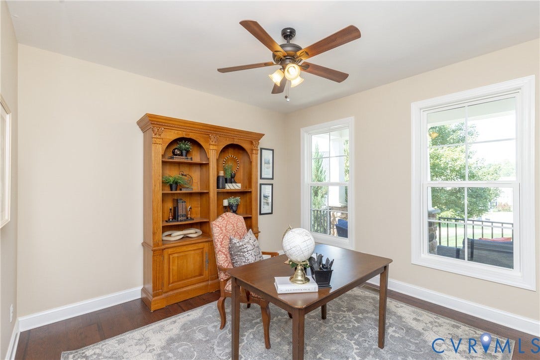 14806 Creekbrook Terrace, Brookcreek Estates, Midlothian, VA 23113 Recessed lighting, wood-finish flooring, two large windows, a built-in wood-finish shelving unit, and a ceiling fan with integrated lighting
