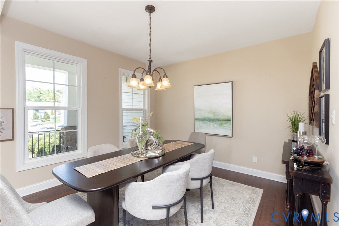 14806 Creekbrook Terrace, Brookcreek Estates, Midlothian, VA 23113 Hardwood-style flooring, warm neutral wall tones, double-hung windows, and a bronze chandelier with bell-shaped shades