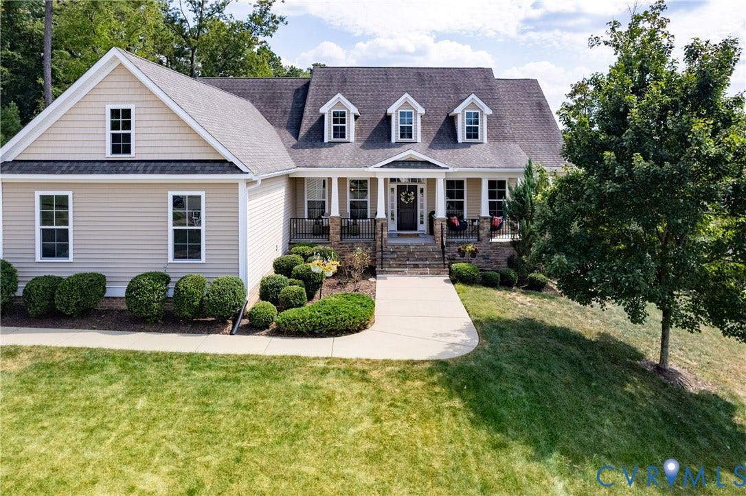 14806 Creekbrook Terrace, Brookcreek Estates, Midlothian, VA 23113 Siding exterior with dormer windows and a covered front porch featuring stone columns and black railings