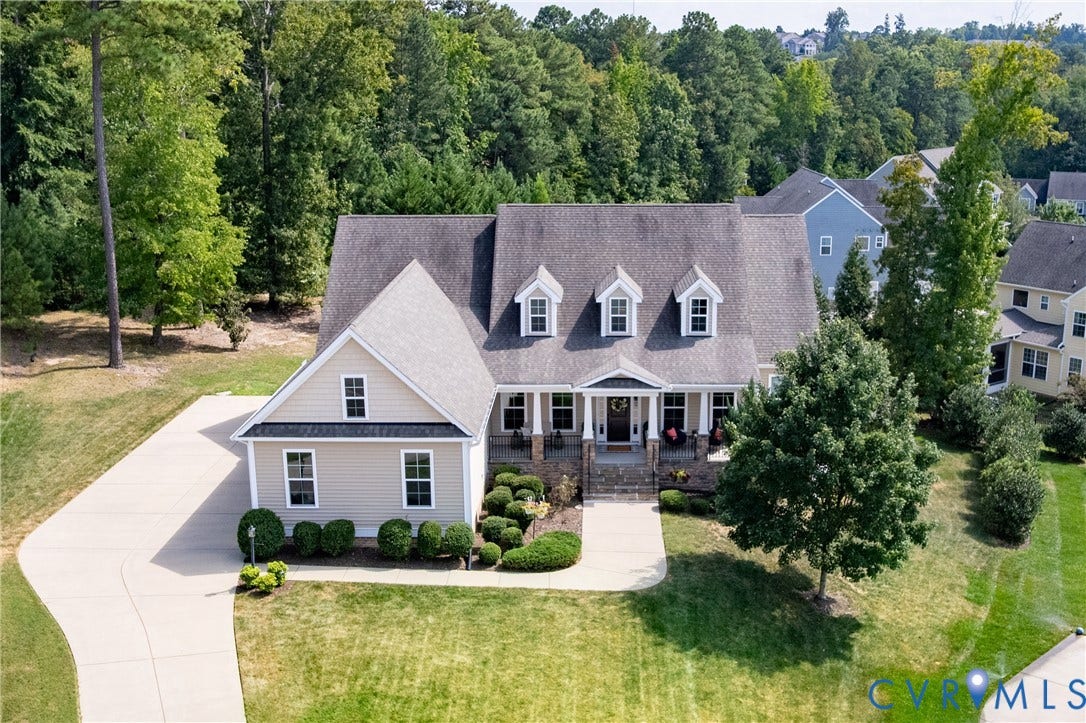 14806 Creekbrook Terrace, Brookcreek Estates, Midlothian, VA 23113 Traditional home featuring a light-toned exterior, dark shingle roof, and a covered front porch with stone columns