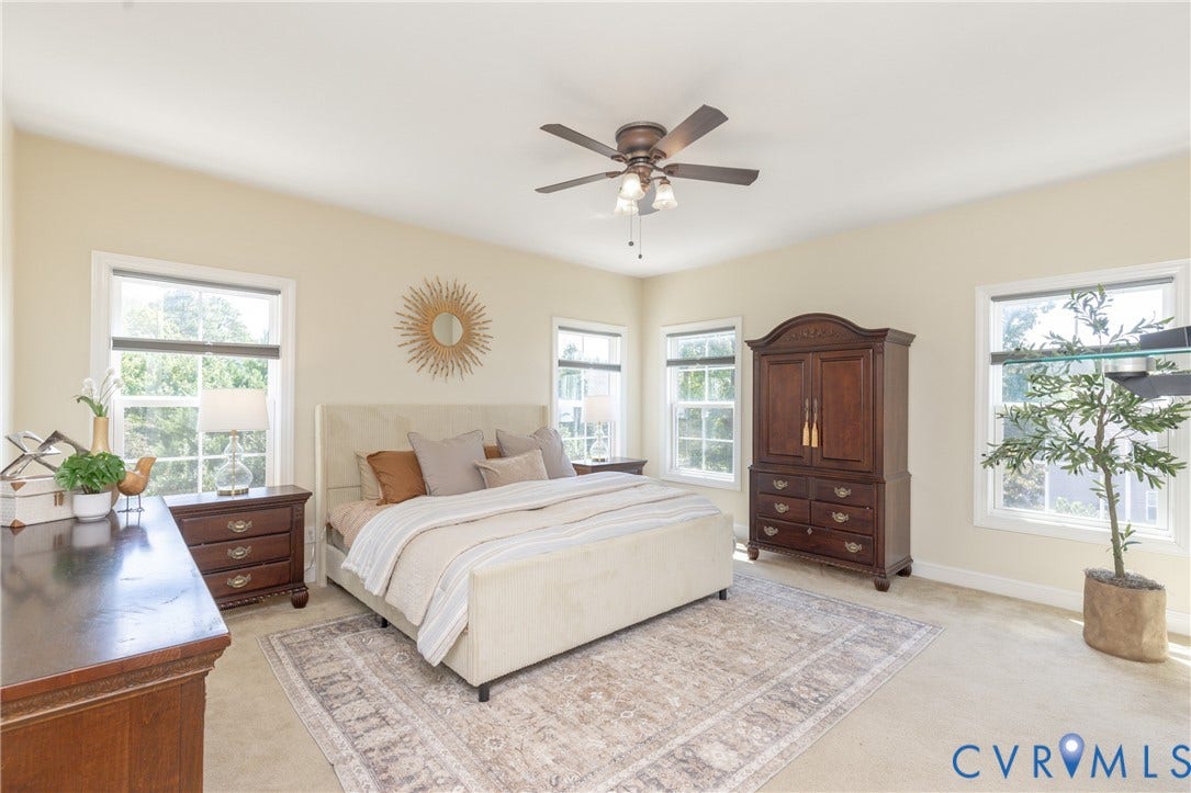 14806 Creekbrook Terrace, Brookcreek Estates, Midlothian, VA 23113 Vaulted ceiling, multiple windows, ceiling fan, and light-toned carpeting