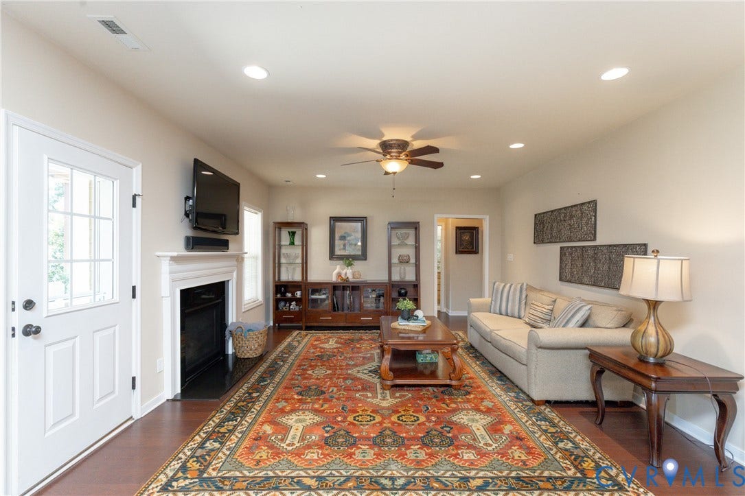 14806 Creekbrook Terrace, Brookcreek Estates, Midlothian, VA 23113 Living space featuring wood-finish flooring, a white mantel, and a ceiling fan