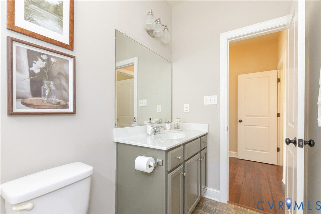 14806 Creekbrook Terrace, Brookcreek Estates, Midlothian, VA 23113 Vanity with a white countertop and undermount sink, gray cabinetry with chrome hardware, and a wall-mounted mirror