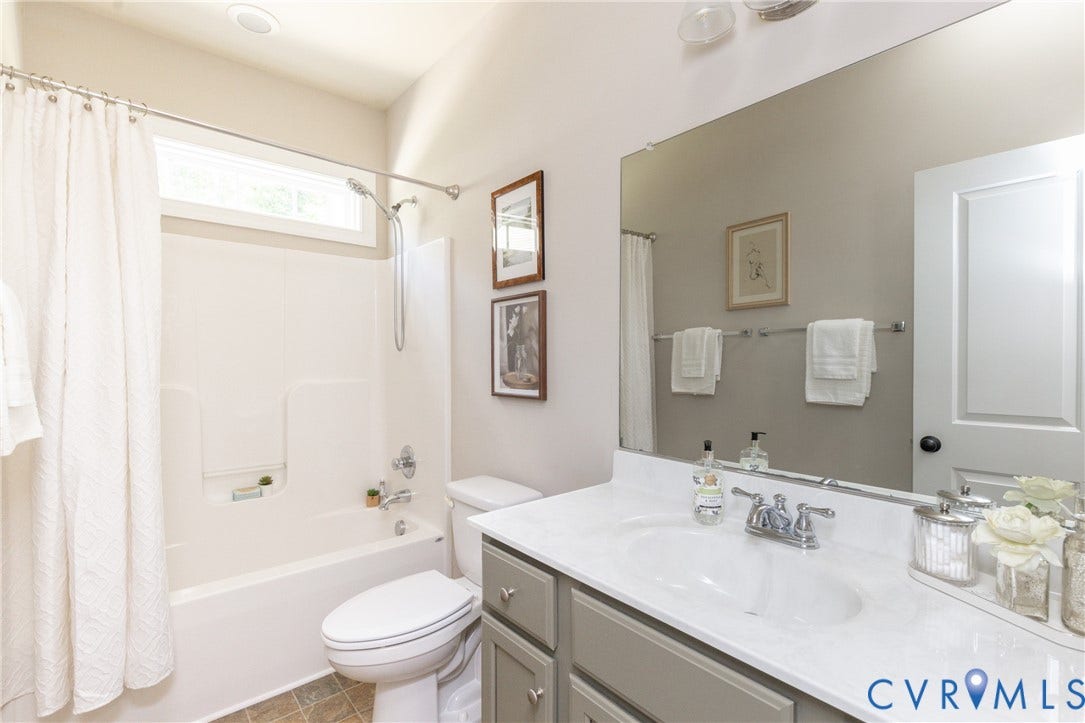 14806 Creekbrook Terrace, Brookcreek Estates, Midlothian, VA 23113 Full bathroom featuring a single vanity with a white countertop, chrome fixtures, a shower/tub combination, and tiled flooring