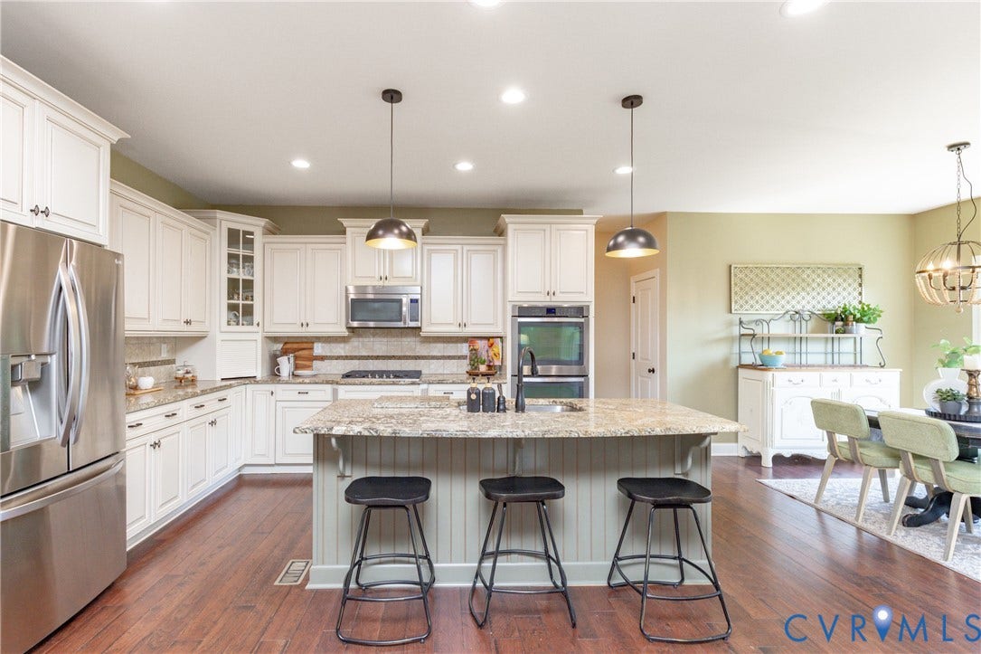 14806 Creekbrook Terrace, Brookcreek Estates, Midlothian, VA 23113 Kitchen featuring wood-finish flooring, white cabinetry, stainless steel appliances, a center island with a speckled countertop, and recessed lighting