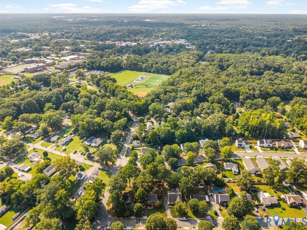 Residential neighborhood with mature trees, established streets, and varied housing styles