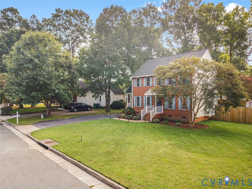 Brick exterior with white siding accents