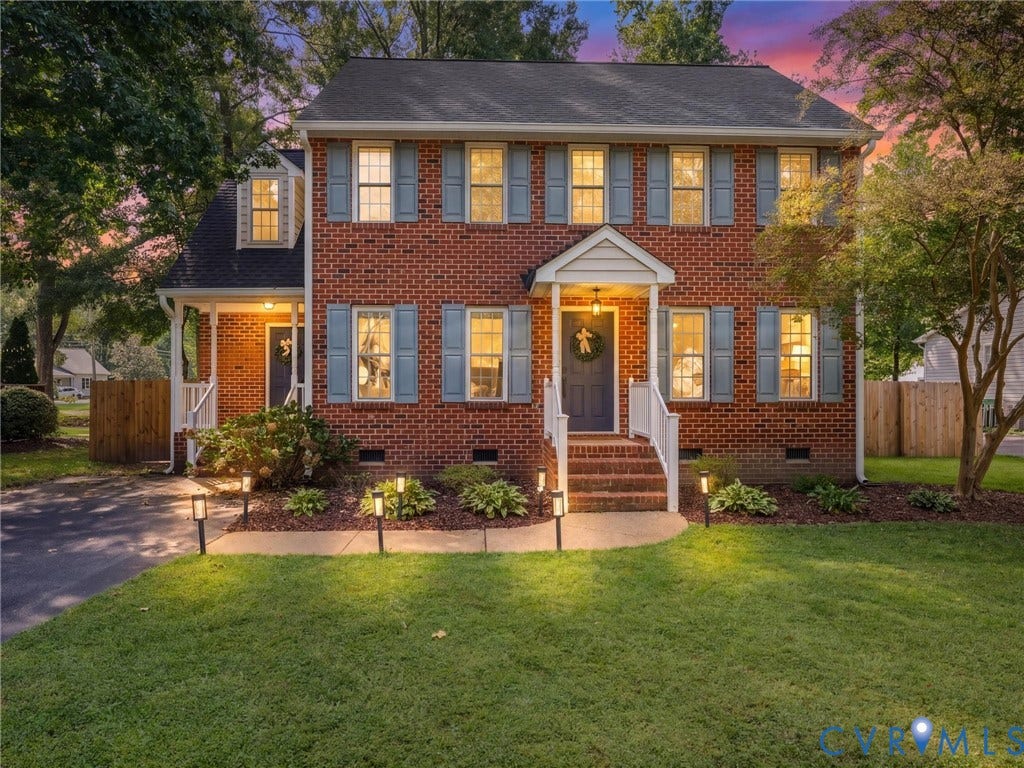 Brick exterior with a covered front entry and dormer window