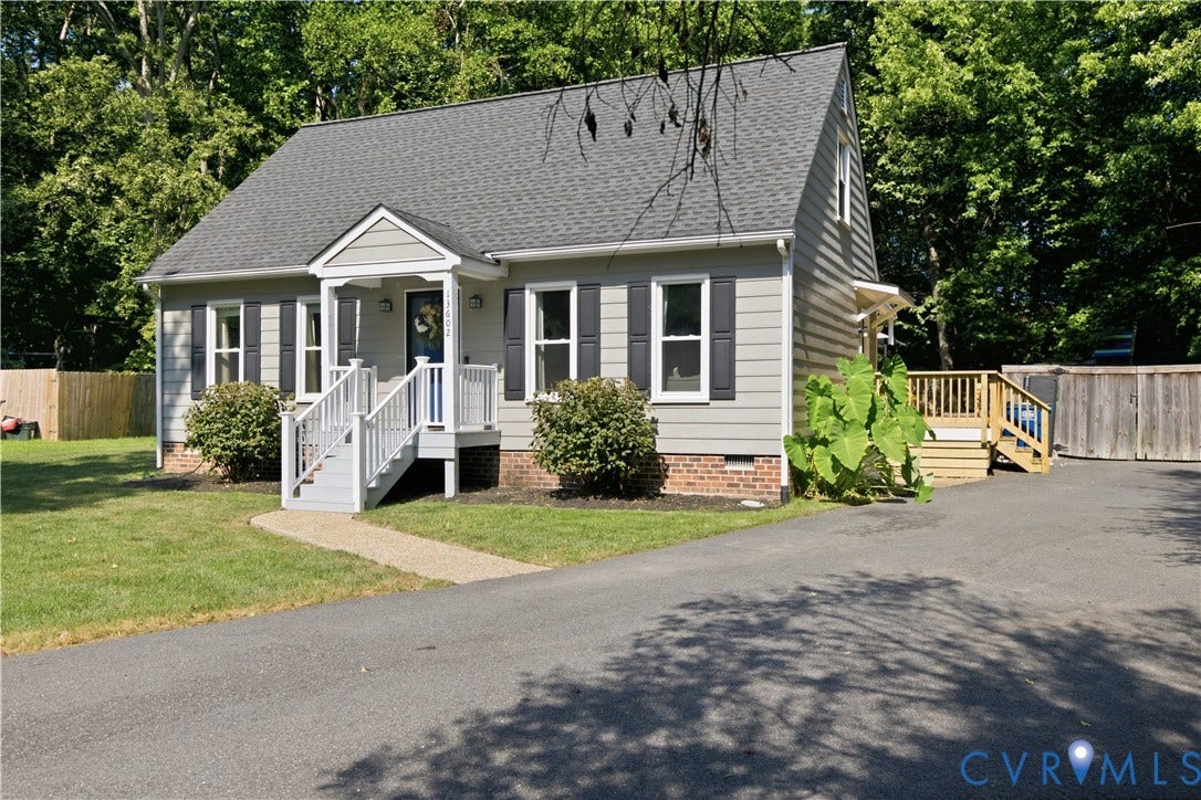 13602 Velvet Antler Place, Midlothian, VA 23112 Gabled roofline, siding exterior, front porch with white railings, paved driveway, and a wood deck