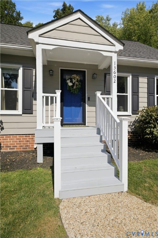 13602 Velvet Antler Place, Midlothian, VA 23112 Covered front porch with white railings, a blue entry door, and exterior sconce lighting