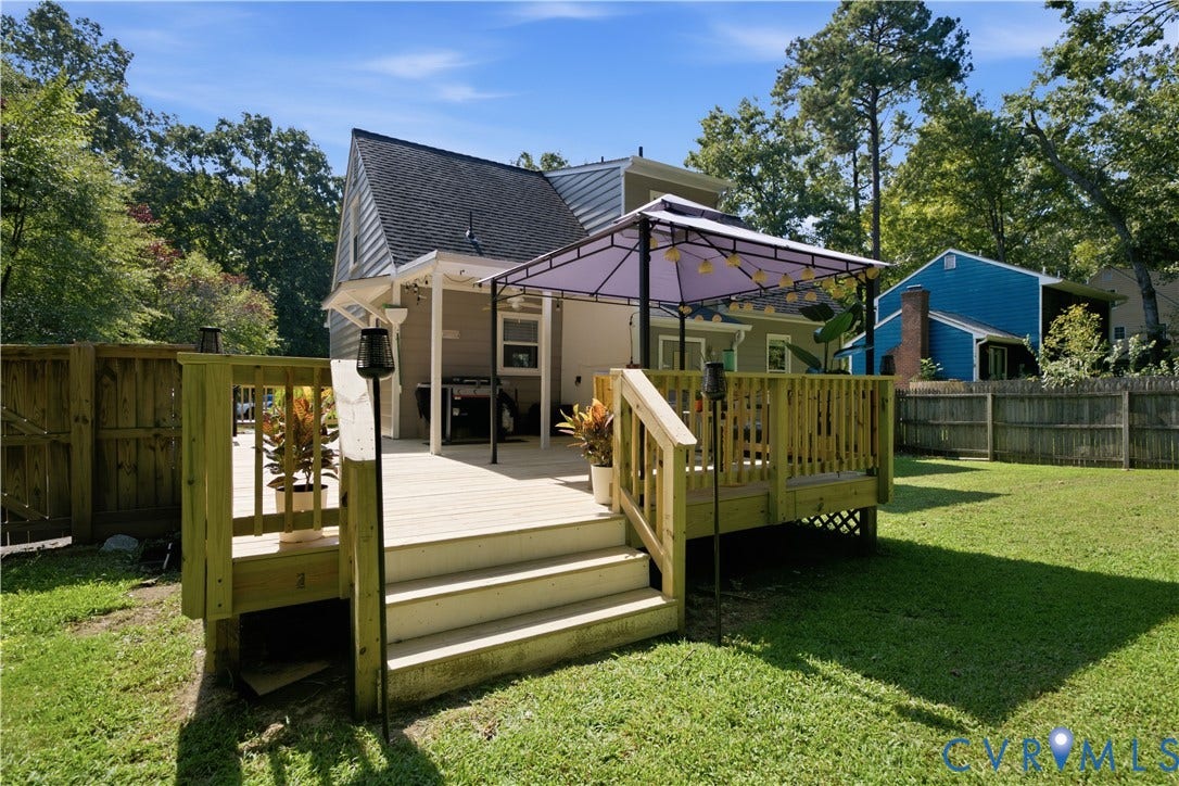 13602 Velvet Antler Place, Midlothian, VA 23112 Expansive backyard featuring a multi-level wood deck, mature trees, and a wooden privacy fence
