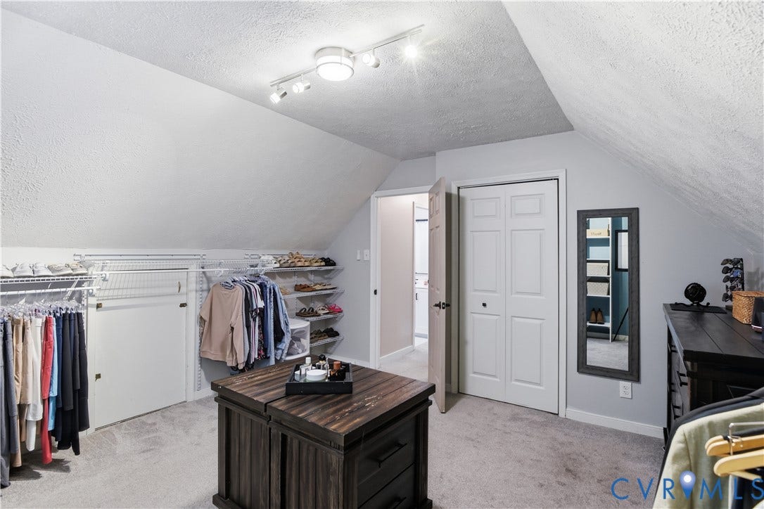 13602 Velvet Antler Place, Midlothian, VA 23112 Carpeted flooring, vaulted ceiling, track lighting, bi-fold door, and built-in closet shelving