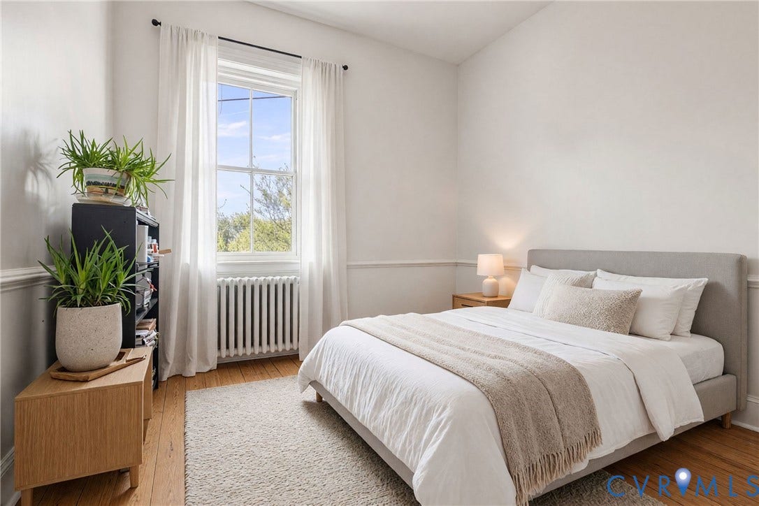1527 Grove Avenue, #3, Richmond, VA 23220 Hardwood flooring, large single-pane window, baseboard radiator, crown molding, and a neutral wall color