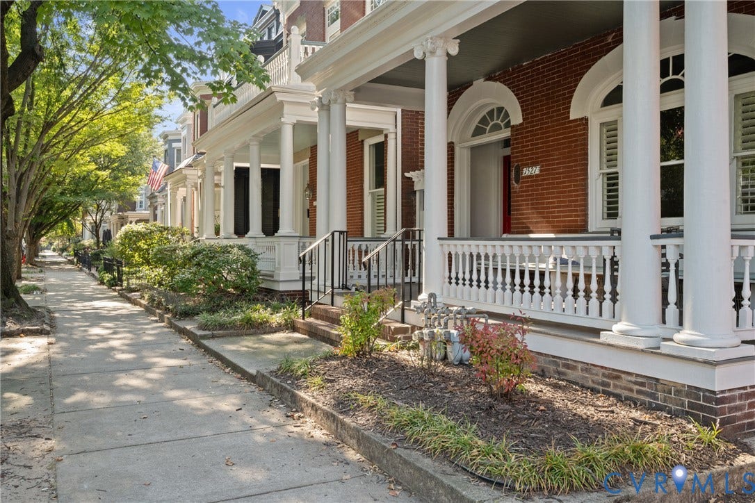 1527 Grove Avenue, #3, Richmond, VA 23220 Brick facade with arched windows, prominent white columns, and a balustrade porch railing