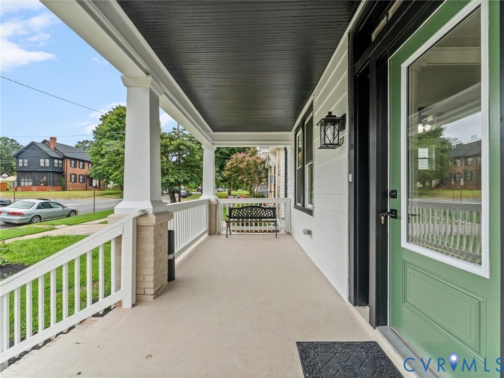 2623 Northumberland Avenue, Richmond, VA 23220 Spacious front porch with white columns, brick base, and a dark ceiling