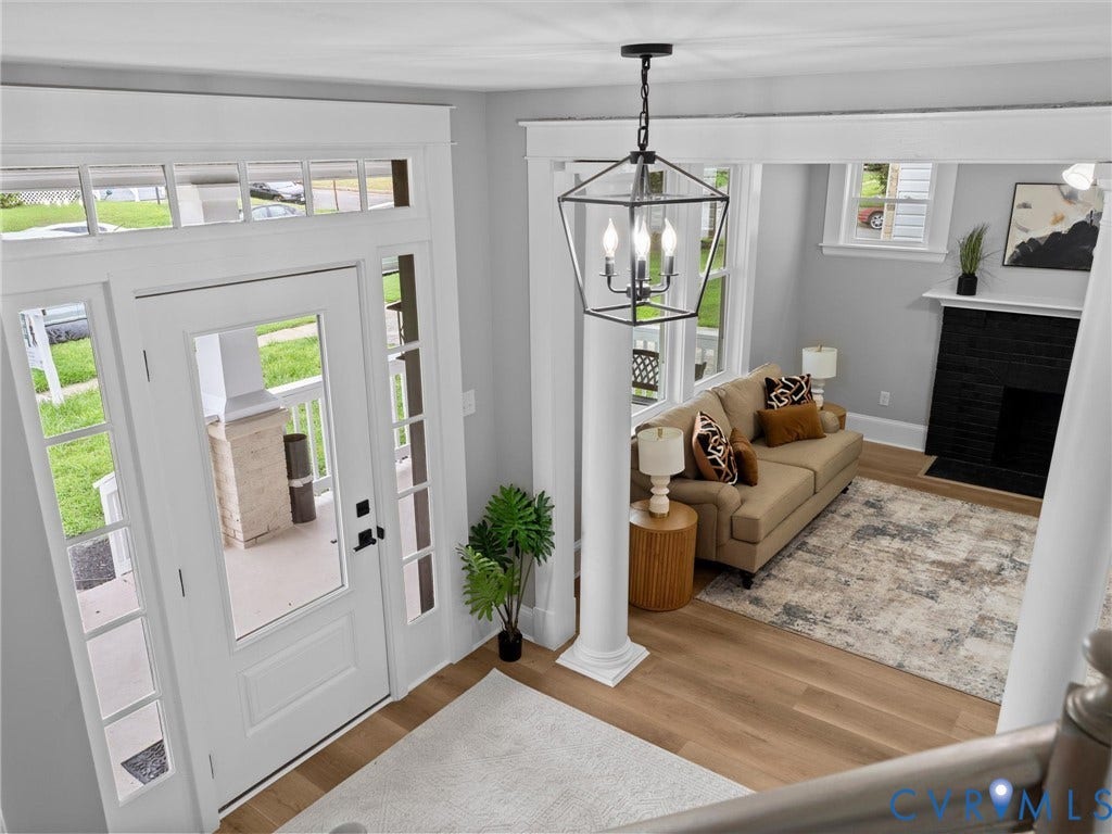 2623 Northumberland Avenue, Richmond, VA 23220 Entryway featuring a glass-paneled door with sidelights and transom, wood-finish flooring, and a decorative column