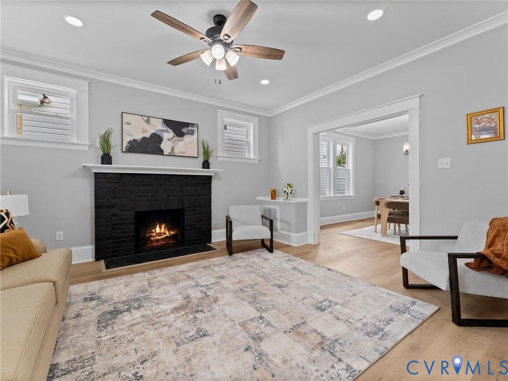 2623 Northumberland Avenue, Richmond, VA 23220 Recessed lighting, crown molding, wood-finish flooring, black brick fireplace, and a ceiling fan