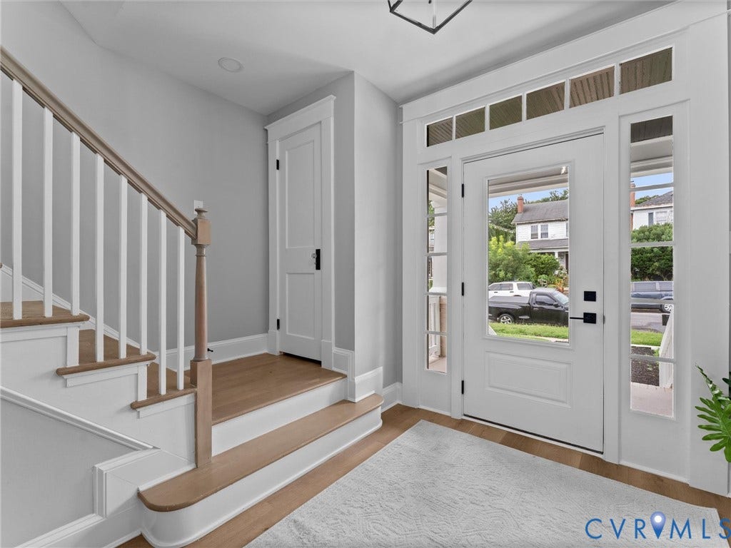 2623 Northumberland Avenue, Richmond, VA 23220 Entryway featuring a solid wood door with glass inserts, transom window, and sidelights