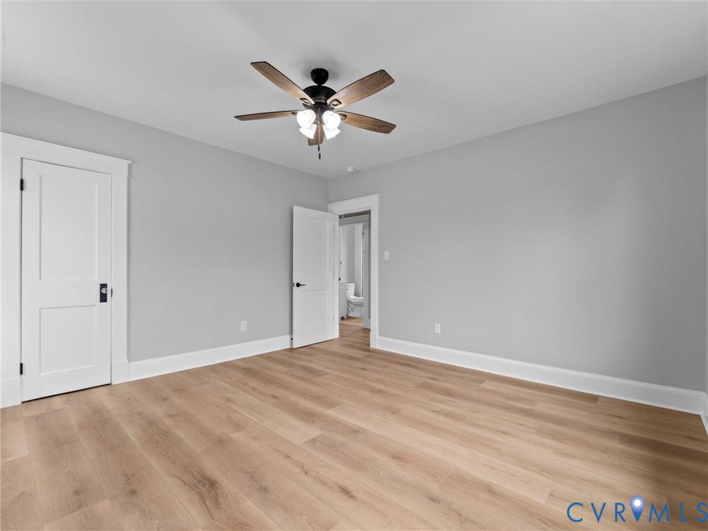2623 Northumberland Avenue, Richmond, VA 23220 Wood-finish flooring, light gray walls, white trim, and a ceiling fan with integrated lighting