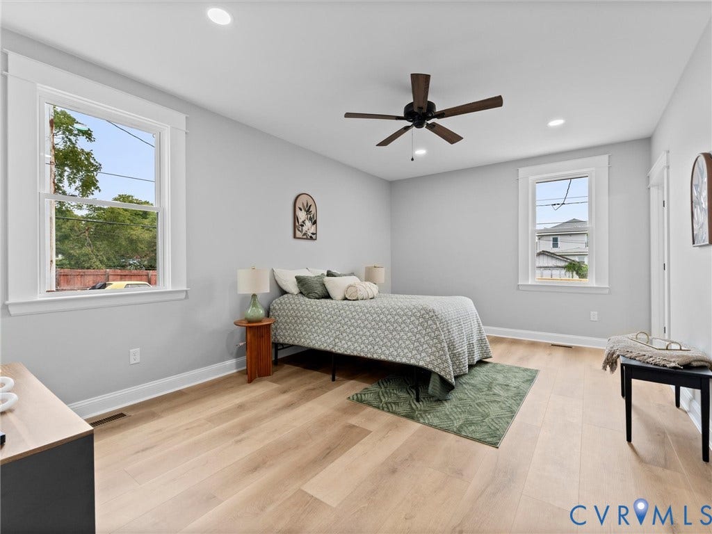 2623 Northumberland Avenue, Richmond, VA 23220 Light-toned wood-finish flooring, recessed lighting, and a ceiling fan with dark wood-tone blades