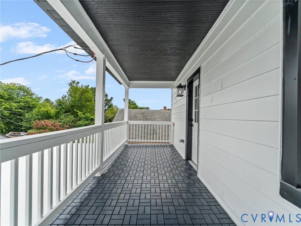 2623 Northumberland Avenue, Richmond, VA 23220 Covered porch with dark-toned plank flooring and white panel siding