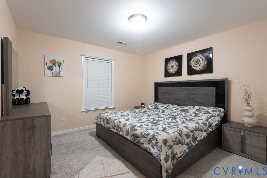 14107 Beachmere Road, Stoney Glen South, Chester, VA 23831 Light-colored walls, window with blinds, overhead lighting, and carpeted flooring
