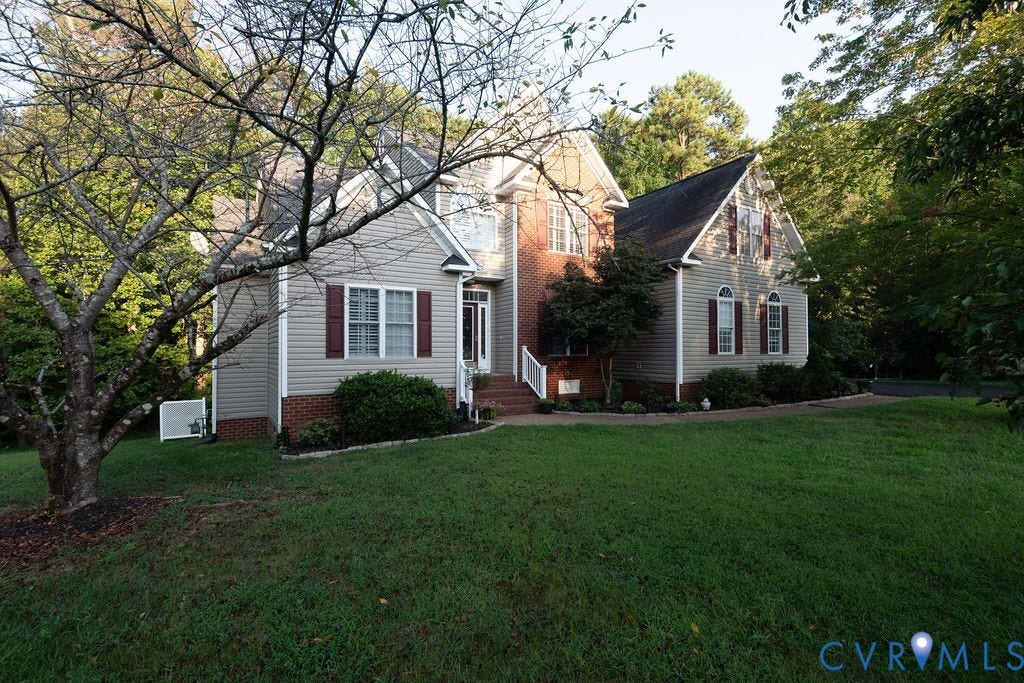 14107 Beachmere Road, Stoney Glen South, Chester, VA 23831 Vinyl siding exterior with brick accents, gabled rooflines, red shutters, and an expansive lawn