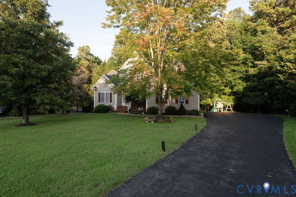 14107 Beachmere Road, Stoney Glen South, Chester, VA 23831 Two-story residence with light-colored siding and a covered front entry