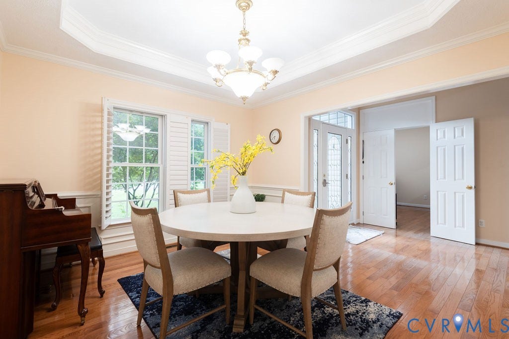 14107 Beachmere Road, Stoney Glen South, Chester, VA 23831 Wood-finish flooring, tray ceiling with crown molding, double front entry doors with decorative glass, and window shutters