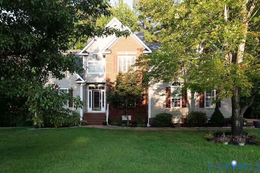 14107 Beachmere Road, Stoney Glen South, Chester, VA 23831 Brick and siding exterior with a large arched window