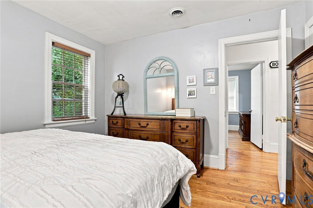 1427 Spring Grove Drive, Richmond, VA 23225 Hardwood flooring, window with blinds, light gray wall finish, white trim, recessed ceiling vent