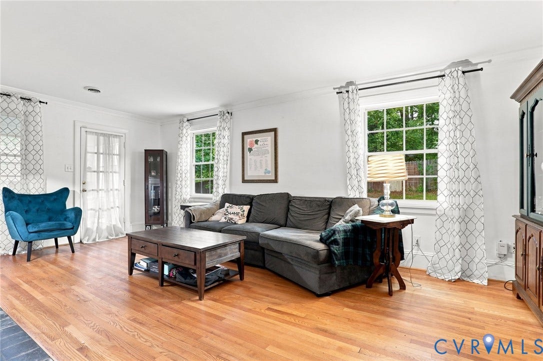 1427 Spring Grove Drive, Richmond, VA 23225 Hardwood flooring, painted white walls, crown molding, and multiple windows