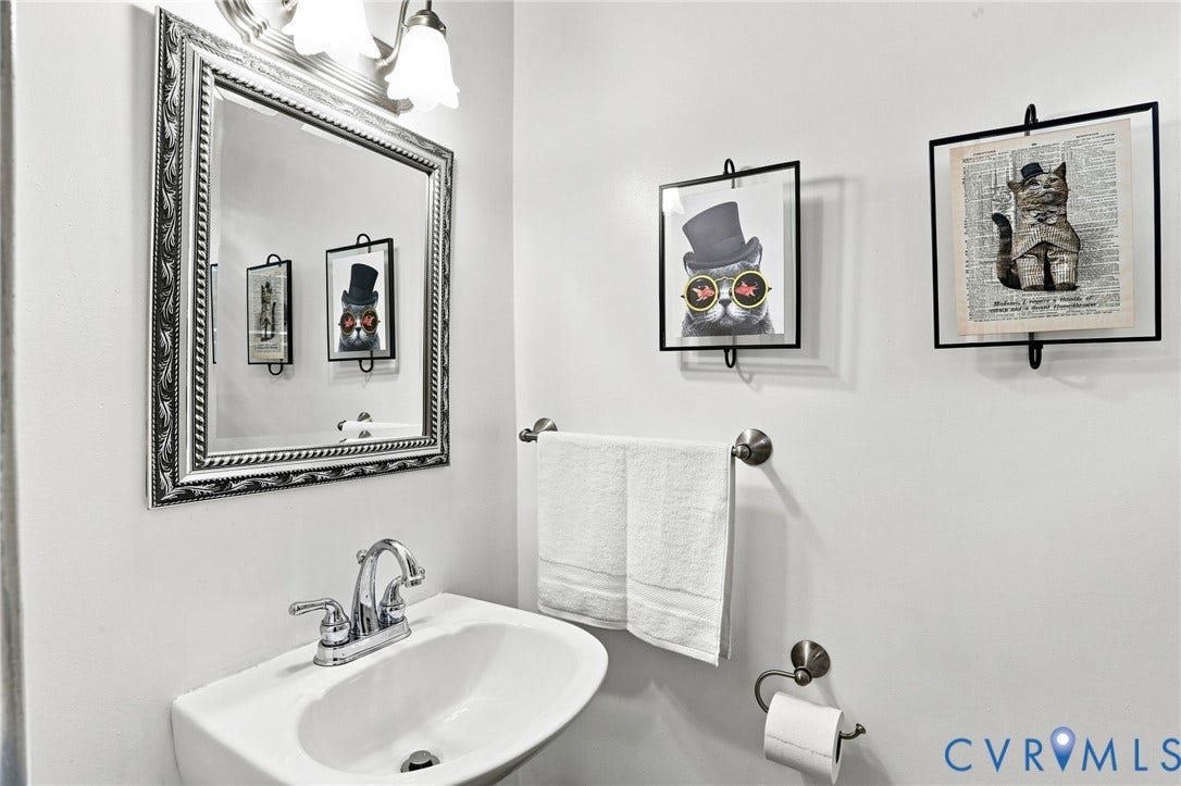 1427 Spring Grove Drive, Richmond, VA 23225 Wall-mounted porcelain sink with chrome faucet
