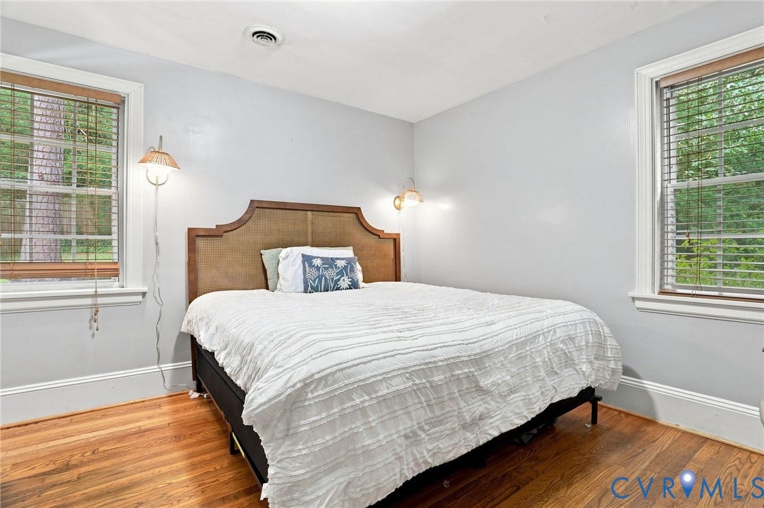 1427 Spring Grove Drive, Richmond, VA 23225 Hardwood flooring throughout, white trim, and two windows with blinds