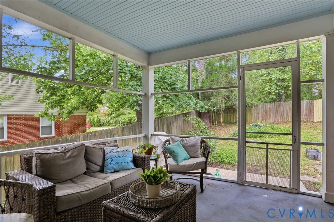 1427 Spring Grove Drive, Richmond, VA 23225 Screened porch with light blue beadboard ceiling, concrete flooring, and white railing