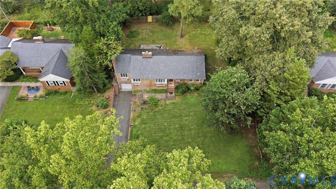 1427 Spring Grove Drive, Richmond, VA 23225 Brick exterior home with a gabled roof and a paved driveway