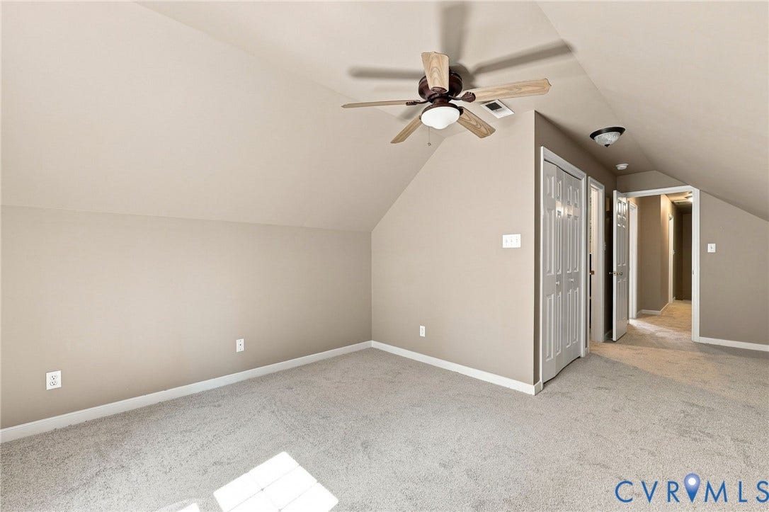3522 Fairfield Road, Powhatan, VA 23139 Carpeted flooring, vaulted ceiling, wood-finish ceiling fan with integrated lighting, bi-fold closet doors, and recessed lighting