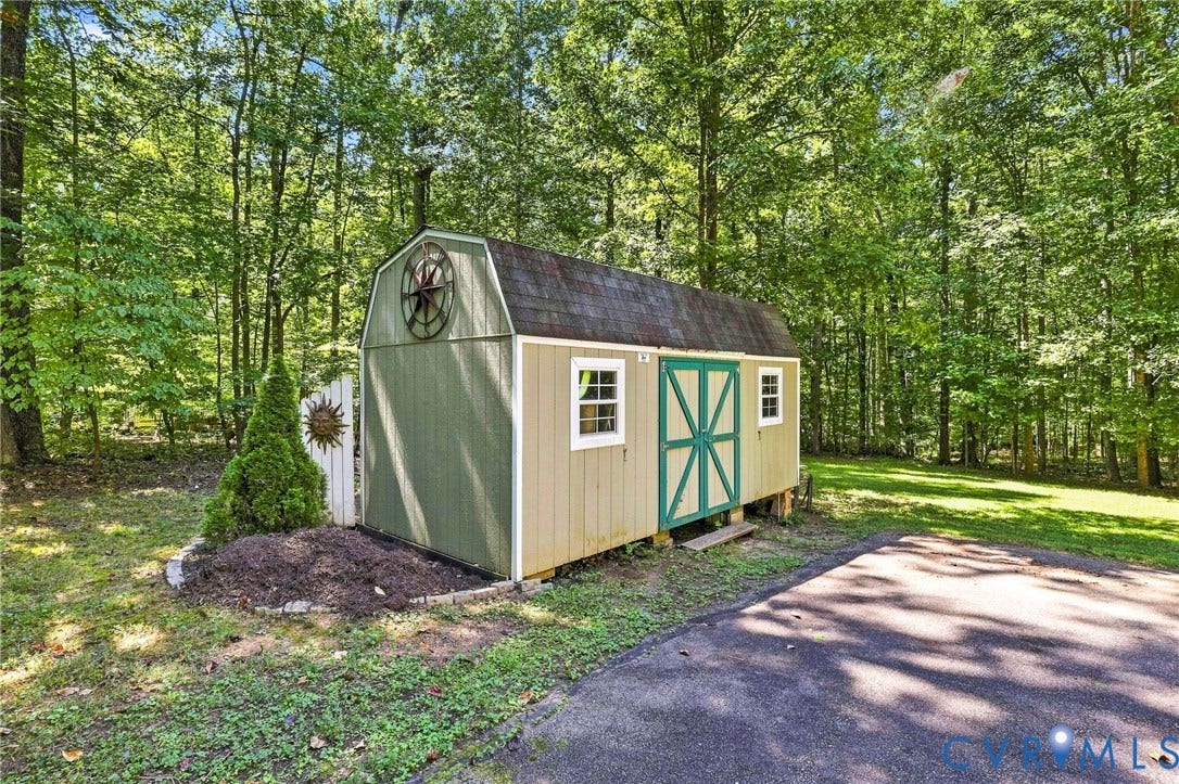 3522 Fairfield Road, Powhatan, VA 23139 Barn-style shed with double doors, multiple windows, and a shingled roof
