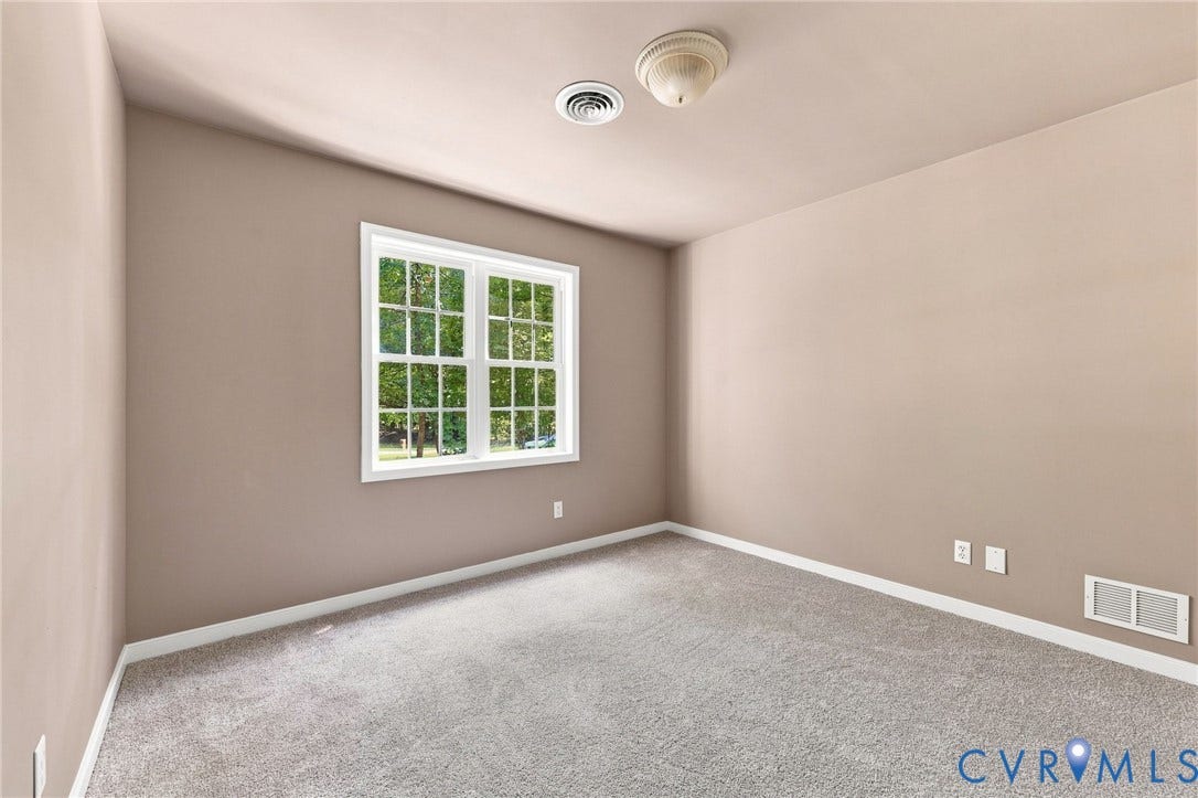 3522 Fairfield Road, Powhatan, VA 23139 Neutral wall color, window with white trim, carpeting, and white baseboards
