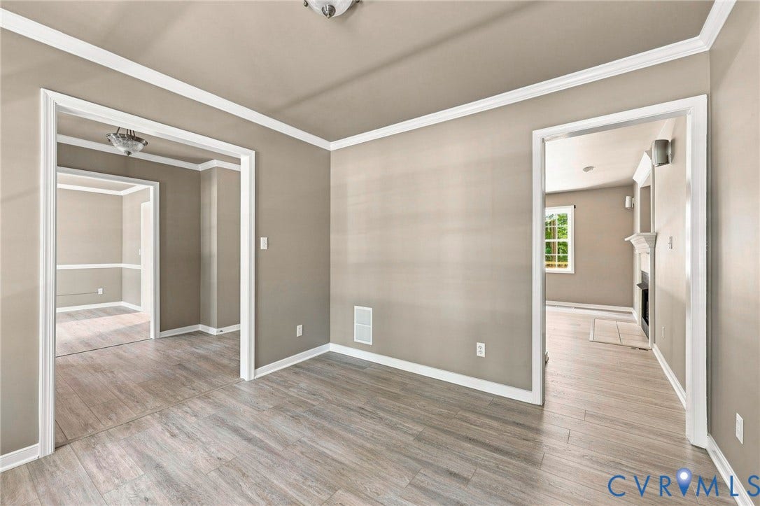 3522 Fairfield Road, Powhatan, VA 23139 Wood-finish flooring throughout, crown molding, and neutral wall tones