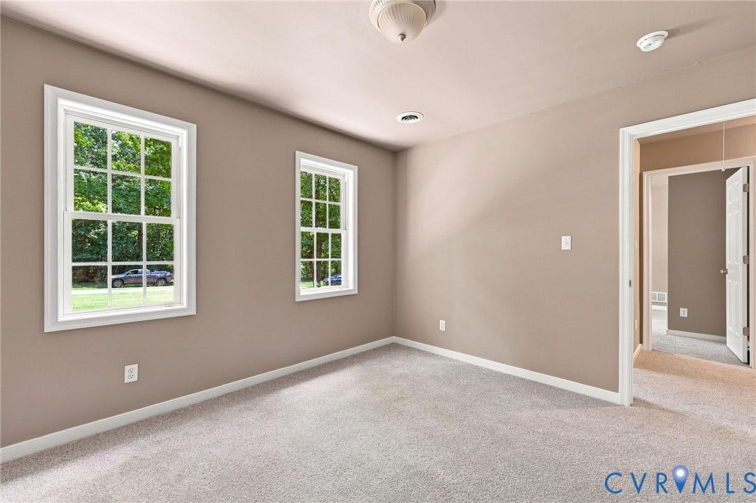 3522 Fairfield Road, Powhatan, VA 23139 Light wall paint, textured light gray carpeting, two double-hung windows, and a flush mount ceiling light